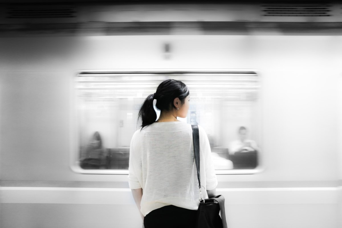 personal branding on social media - why motivation isn't everything - woman standing in a metro station